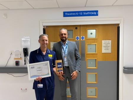 Carl Mauback receiving his award from Steve Christian