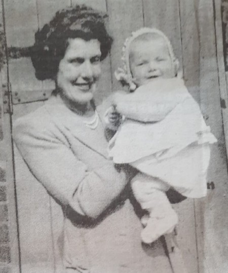 Marcia-Roper-as-baby-with-mum-cutting.jpg